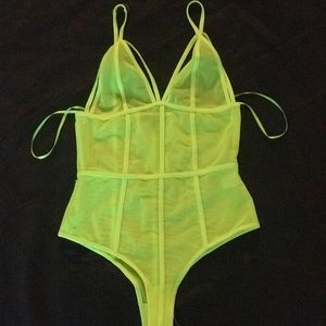 neon green “see through” bodysuit